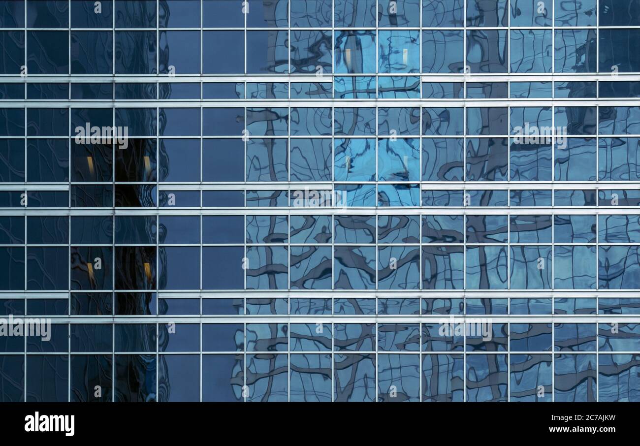 office building windows texture of blue glass for business background, business center generic facade, front view Stock Photo