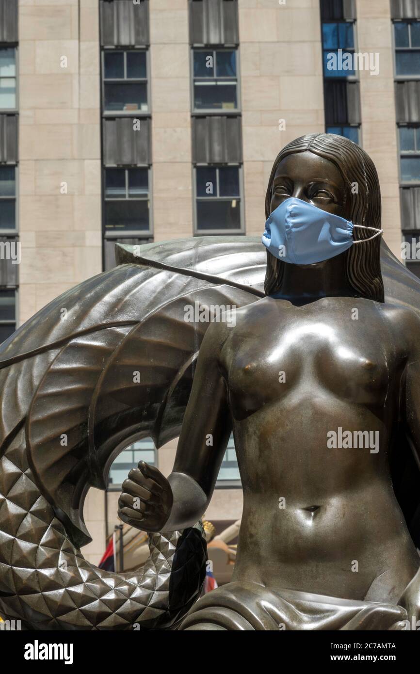 Mankind figure (Maiden and Youth), with Face Mask Rockefeller Center, New York City Stock Photo