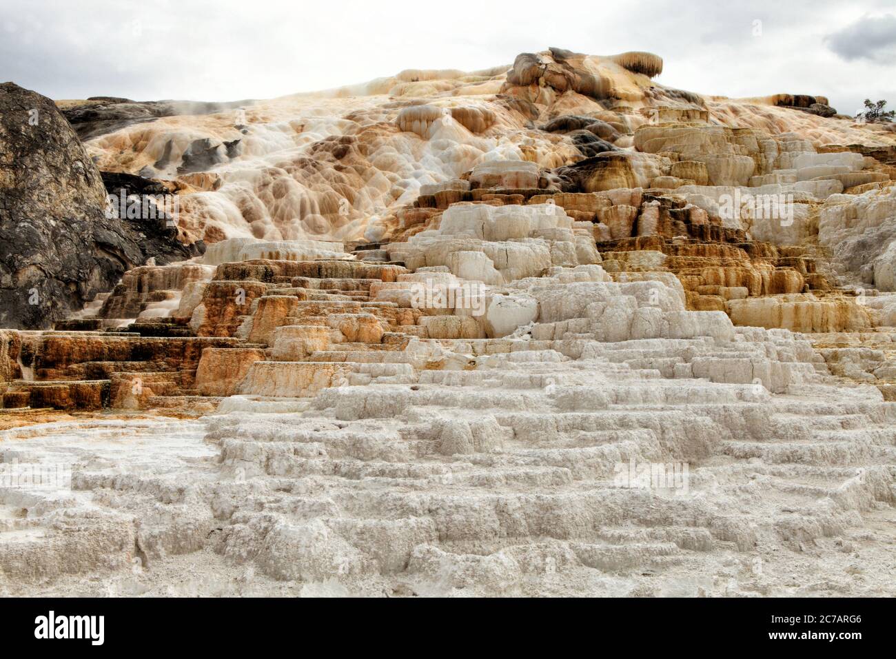 The tiers of travertine at Mammoth Hot Springs in Yellowstone National Park. Stock Photo