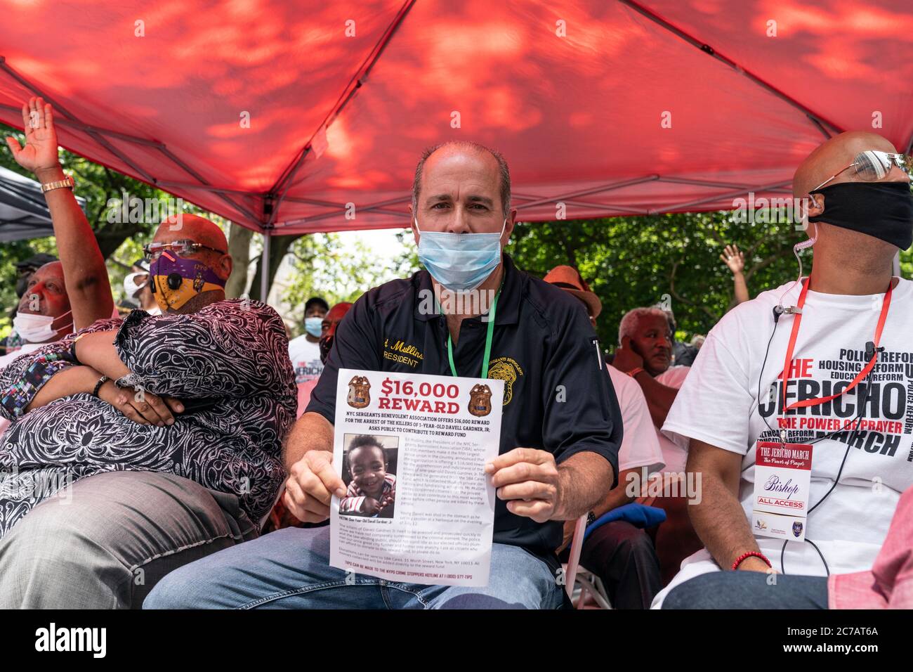New York, NY - July 15, 2020: President of SBA Ed Mullins holds poster offering award to capture killer of 1-year-old Davell Gardner Jr at Jericho The Power of Prayer rally and march against gun violence at City Hall Stock Photo