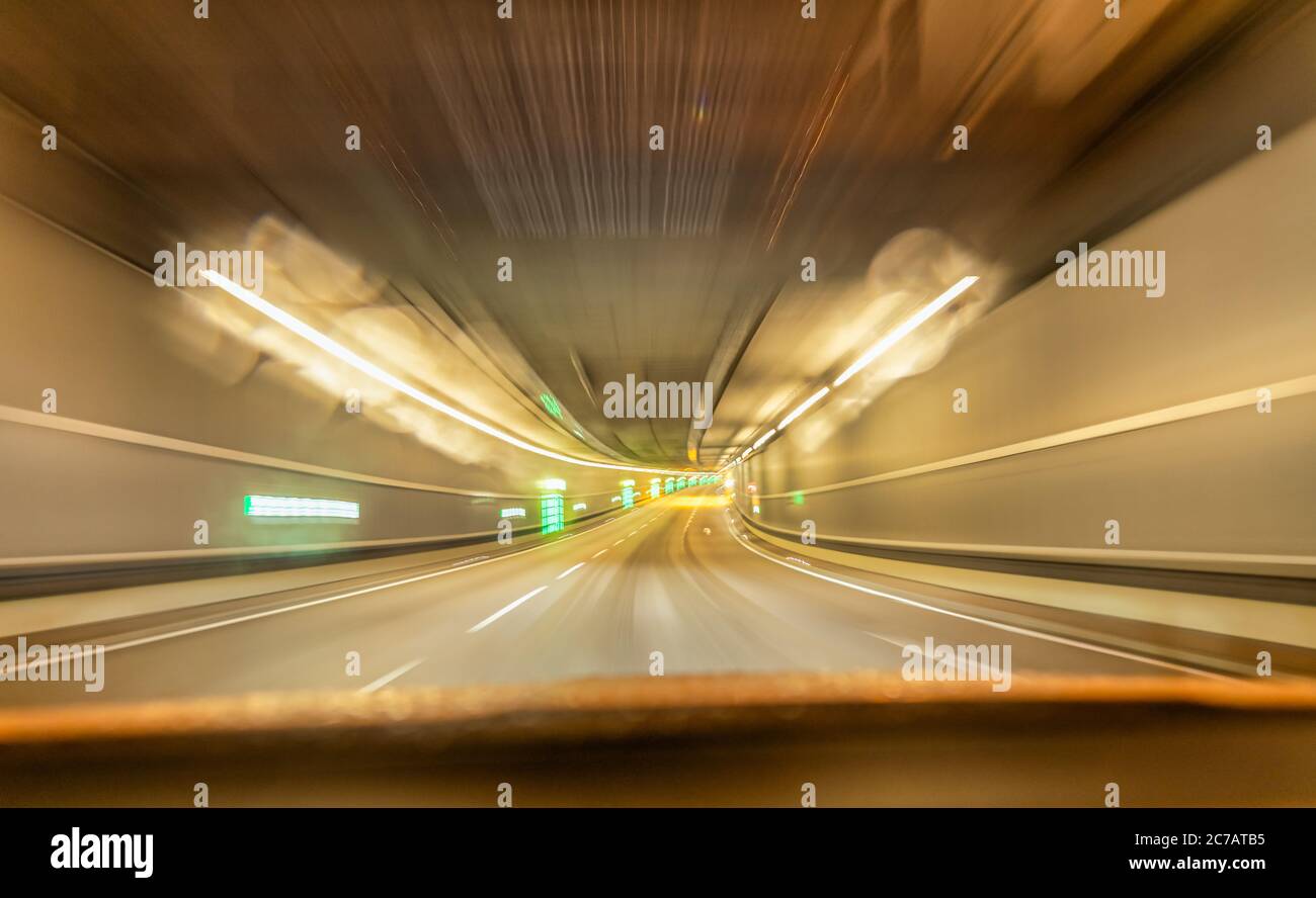 Fast drive with car through underground tunnel street view hires stock