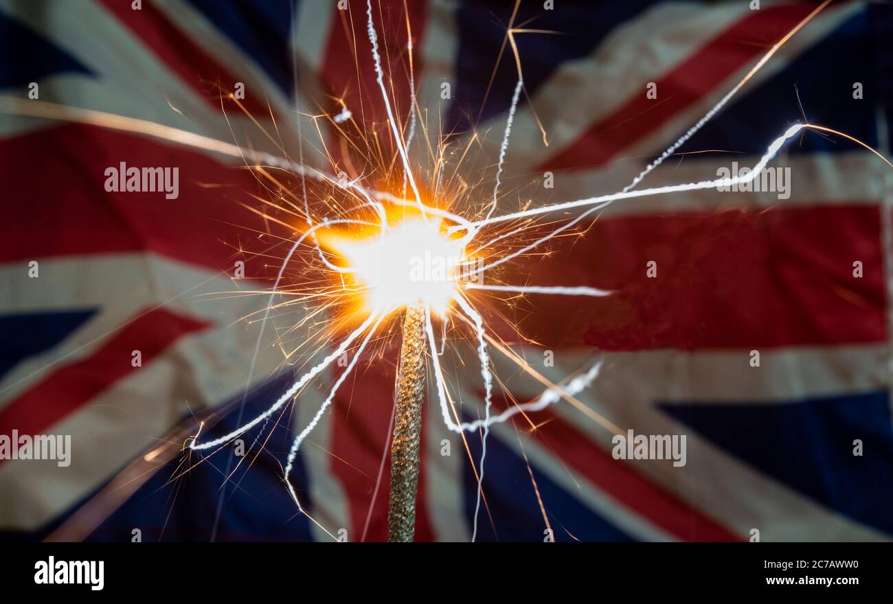 Lit sparkle closeup in front of United Kingdom flag - banner template Stock Photo