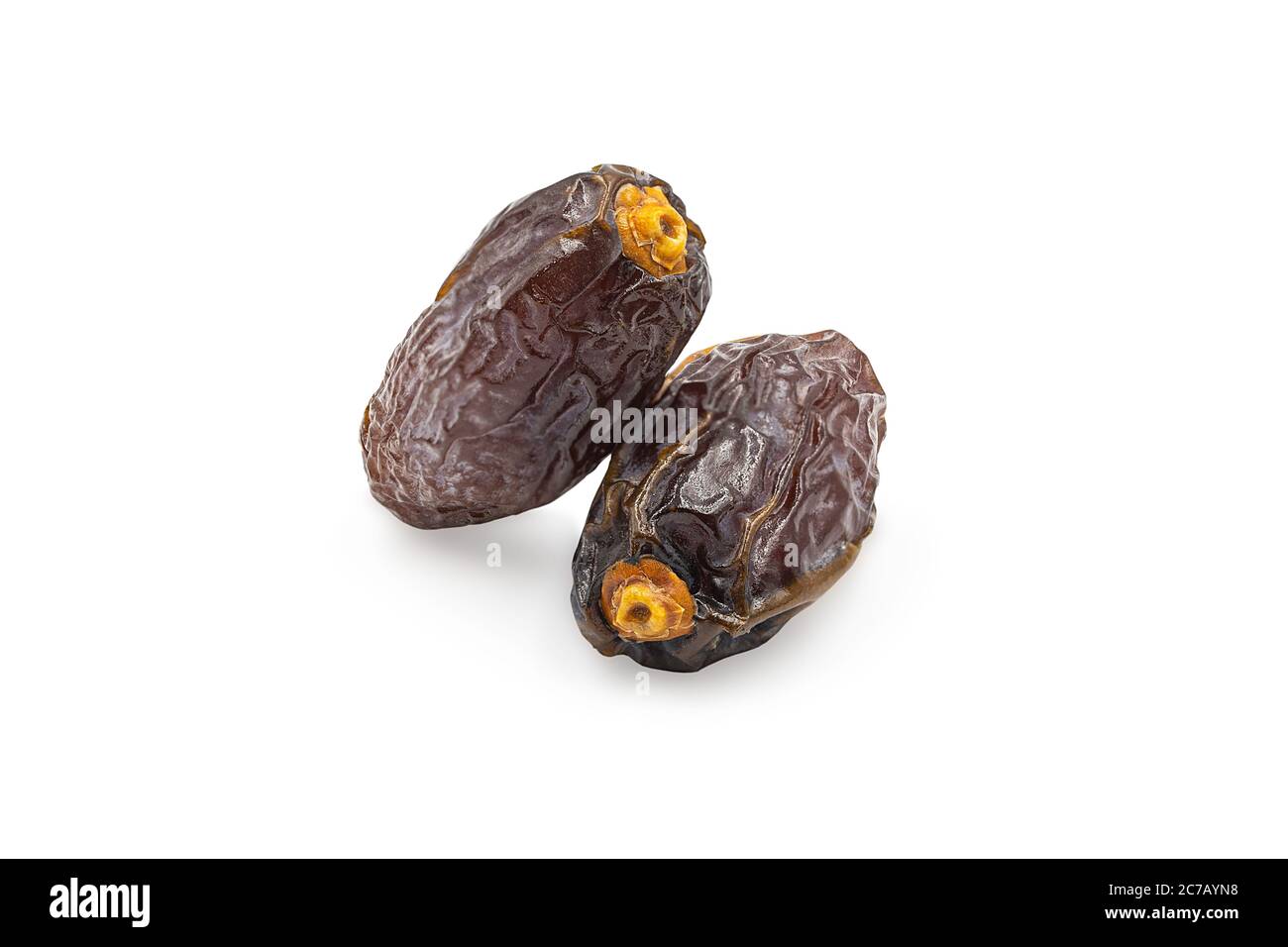 Dried Medjoul date fruit on white isolated background with clipping path. Dates palm is food for Ramadan or medjool month. Delicious dried fruit with Stock Photo