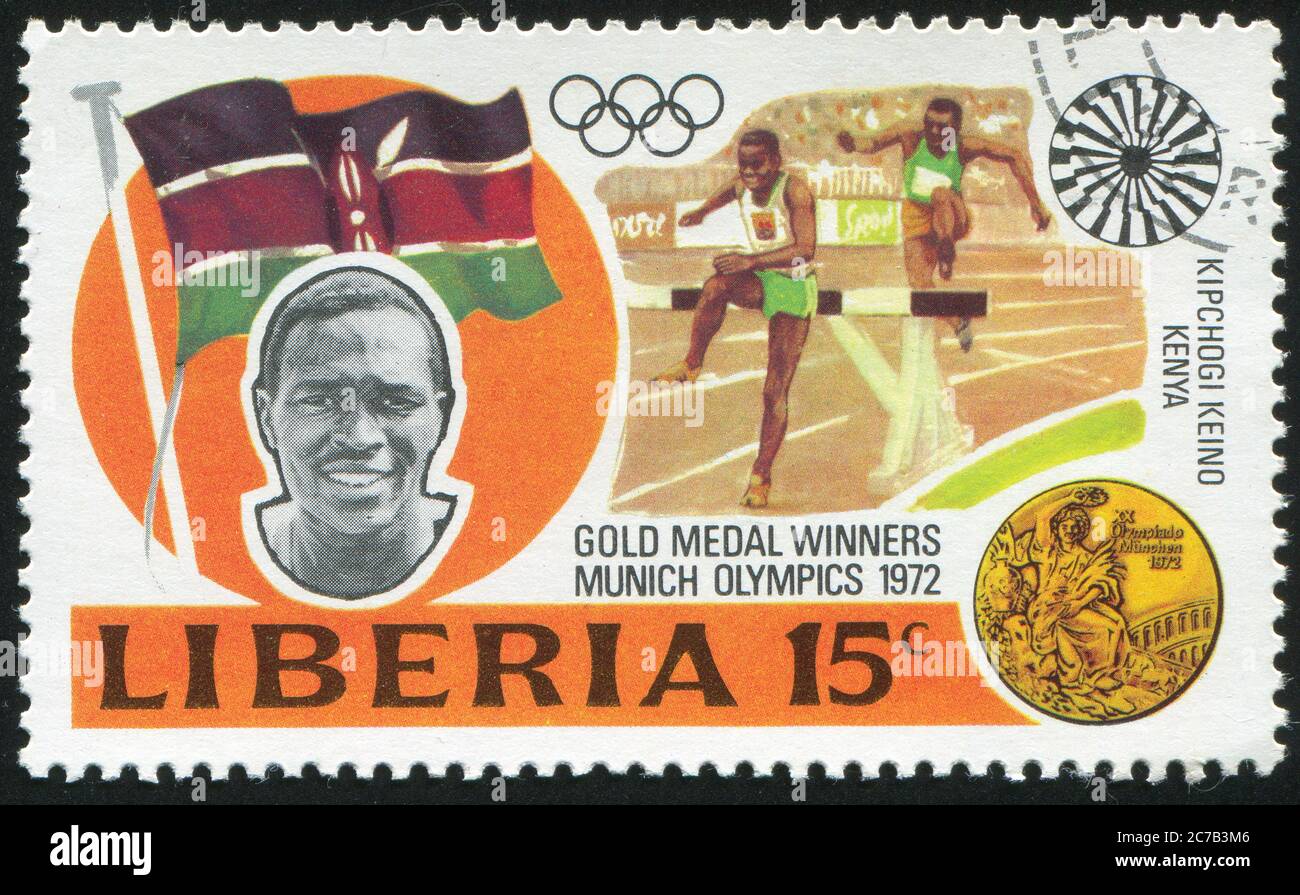 LIBERIA - CIRCA 1973: stamp printed by Liberia, shows Gold medal winners in 20th Olympic Games, Kipchoge Keino, Kenya, 3000-meter steeplechase, circa Stock Photo