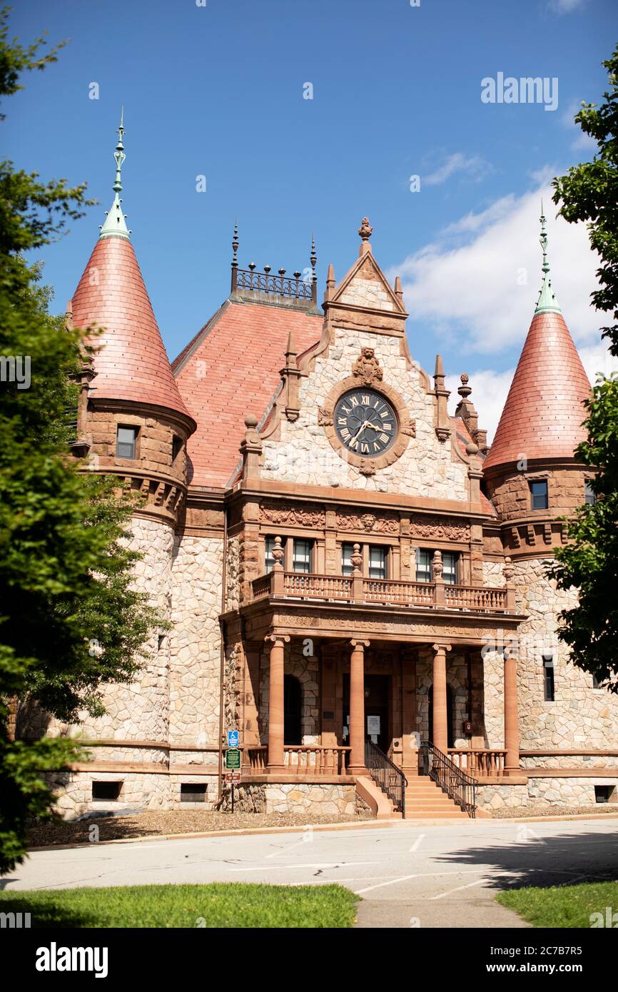 The town hall on Washington Street in Wellesley, Massachusetts, USA. The Victorian Romanesque stone building stands in Morton Park in the town center. Stock Photo