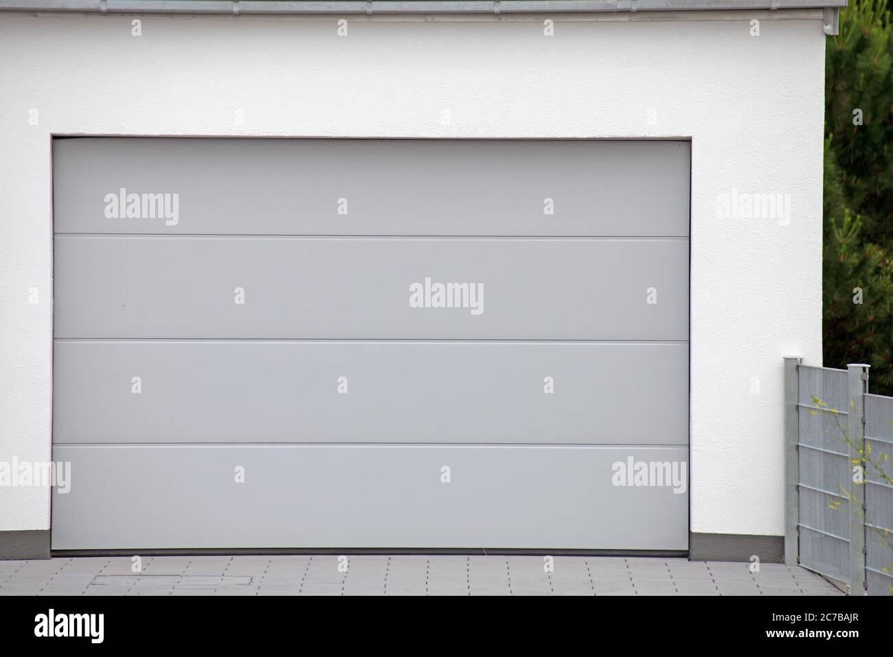 Modern white garage door (sectional door) Stock Photo