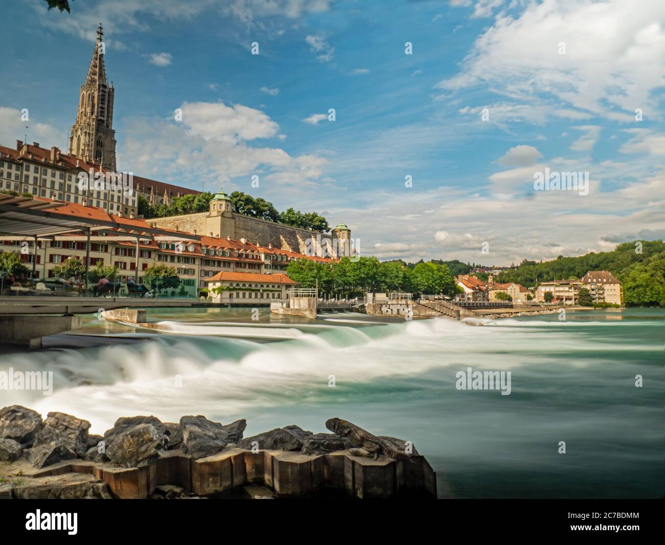 Long exposure, low angle shot of a fast flowing river and Parliament building in Bern, capital of Switzerland. Stock Photo