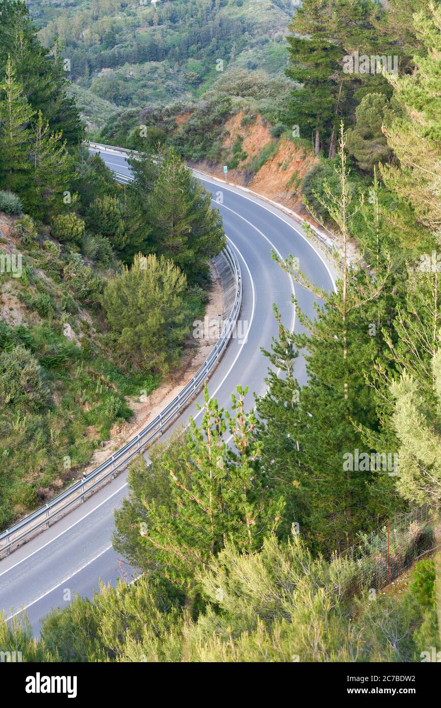 Monda road to Marbella as it passes through Ojen, without traffic. Malaga Stock Photo
