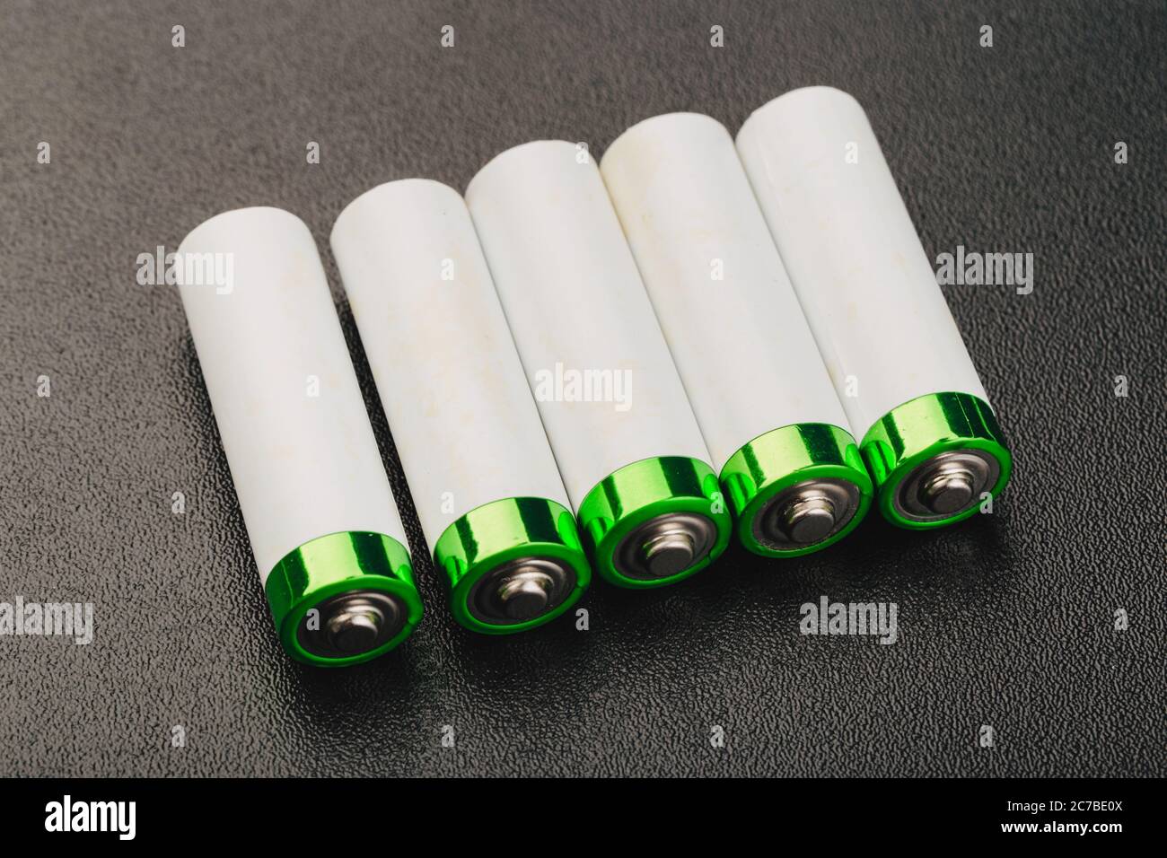 close up of battery positive poles on black backgrounds. intended focused Stock Photo