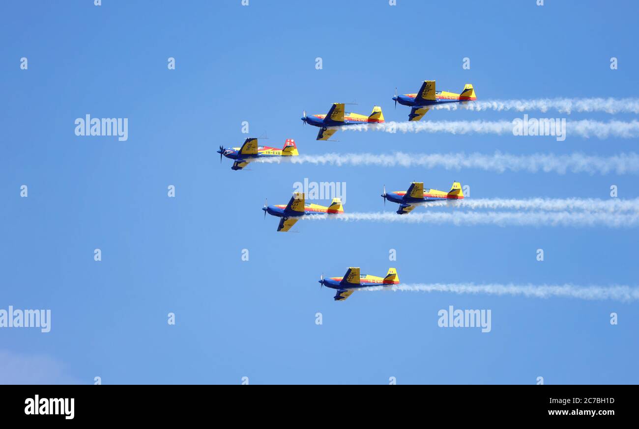 Hawks of Romania aerobatic team of the Romanian Aeroclub with 6 Extra Flugzeugbau EA 300. Airplanes performing acr Stock Photo