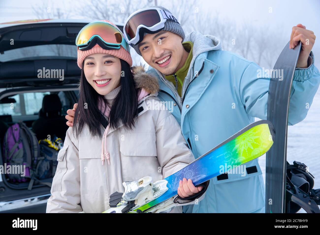 Happy young couples with skis z stand together Stock Photo