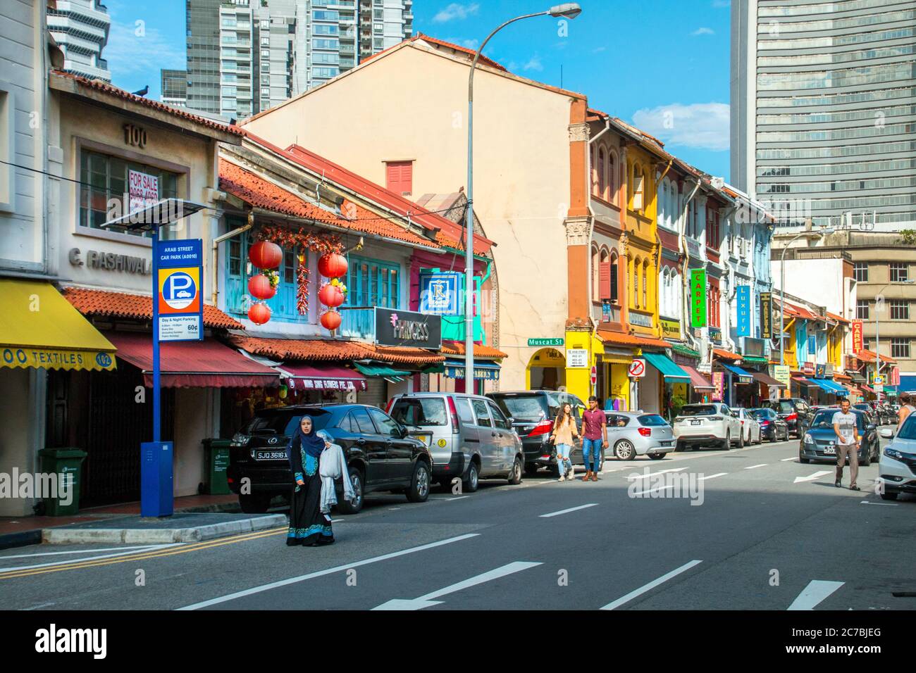 tourists walking in the famous colourful streets of Sultan Mosque ...