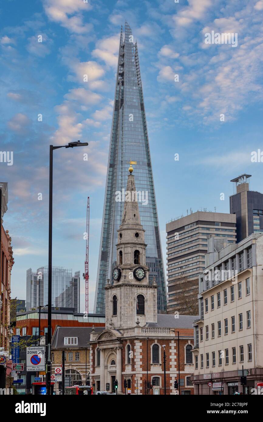 London, England - April 02, 2020: St. George the Martyr church, with the Shard building in the background, on Borough High St in Southwark, London, England Stock Photo
