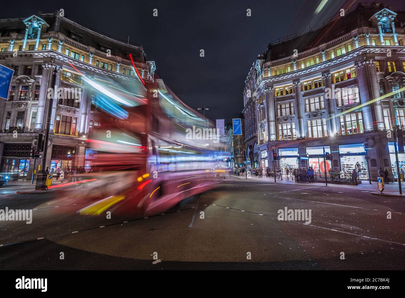 London, United Kingdom. Circa August 2017. Red double-decker bus. Pedestrian and traffic in Oxford Circus at night Stock Photo