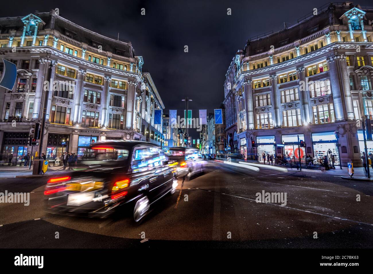 London, United Kingdom. Circa August 2017. London black cab. Pedestrian and traffic in Oxford Circus at night Stock Photo