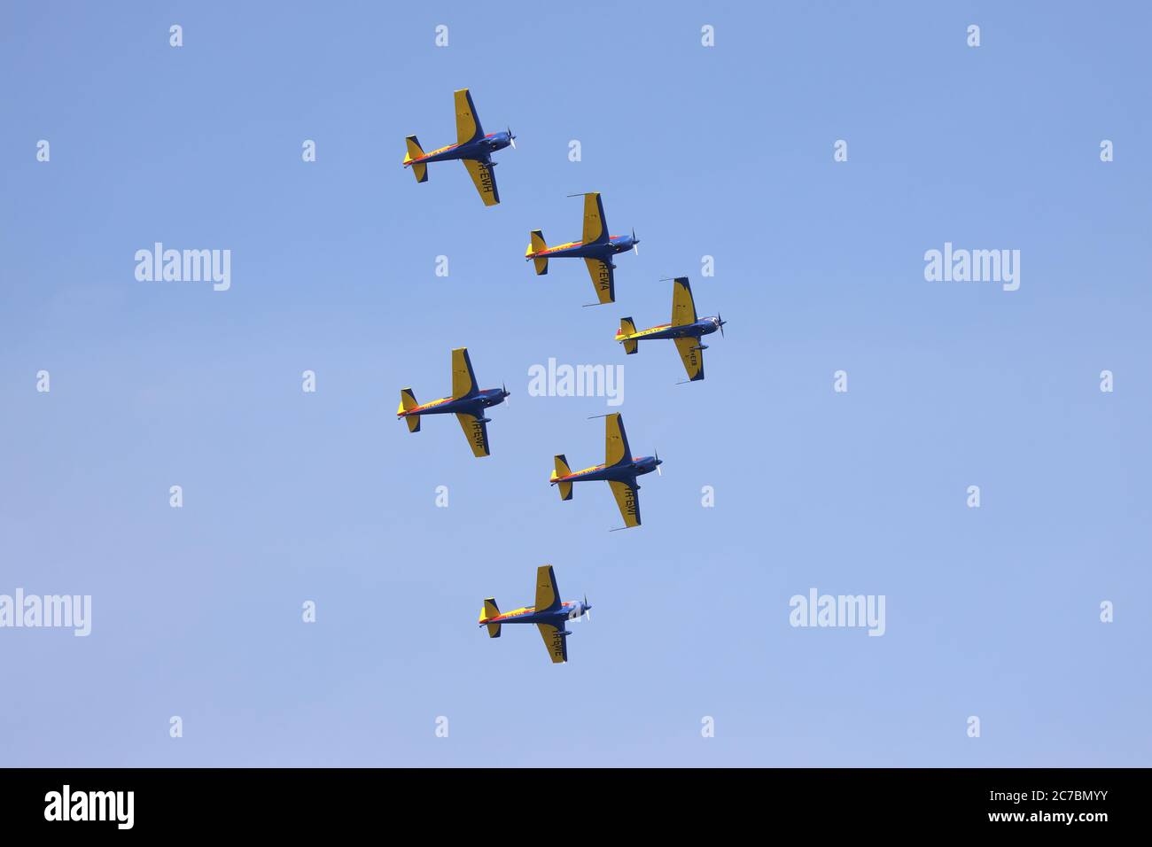 Hawks of Romania aerobatic team of the Romanian Aeroclub with 6 Extra Flugzeugbau EA 300. Airplanes performing acr Stock Photo