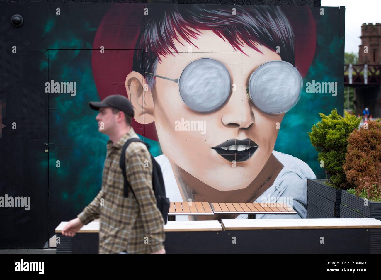 Glasgow Scotland, UK. 16th July, 2020. Pictured: New artworks and murals appear on the Clutha Bar on the Broomielaw area of Glasgow. The bar is well known for its large format artworks on the buildings exterior. The Clutha Bar was synonymous with live music, and then it was marred by tragedy when a police helicopter crashed into it the pub on November 2013, however the people of Glasgow have rallied around it, making the Bar into a living artwork and celebrating the spirit of Glasgow. Credit: Colin Fisher/Alamy Live News Stock Photo