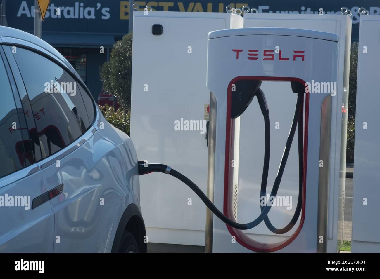 Electric Tesla car at Charging Station Stock Photo - Alamy