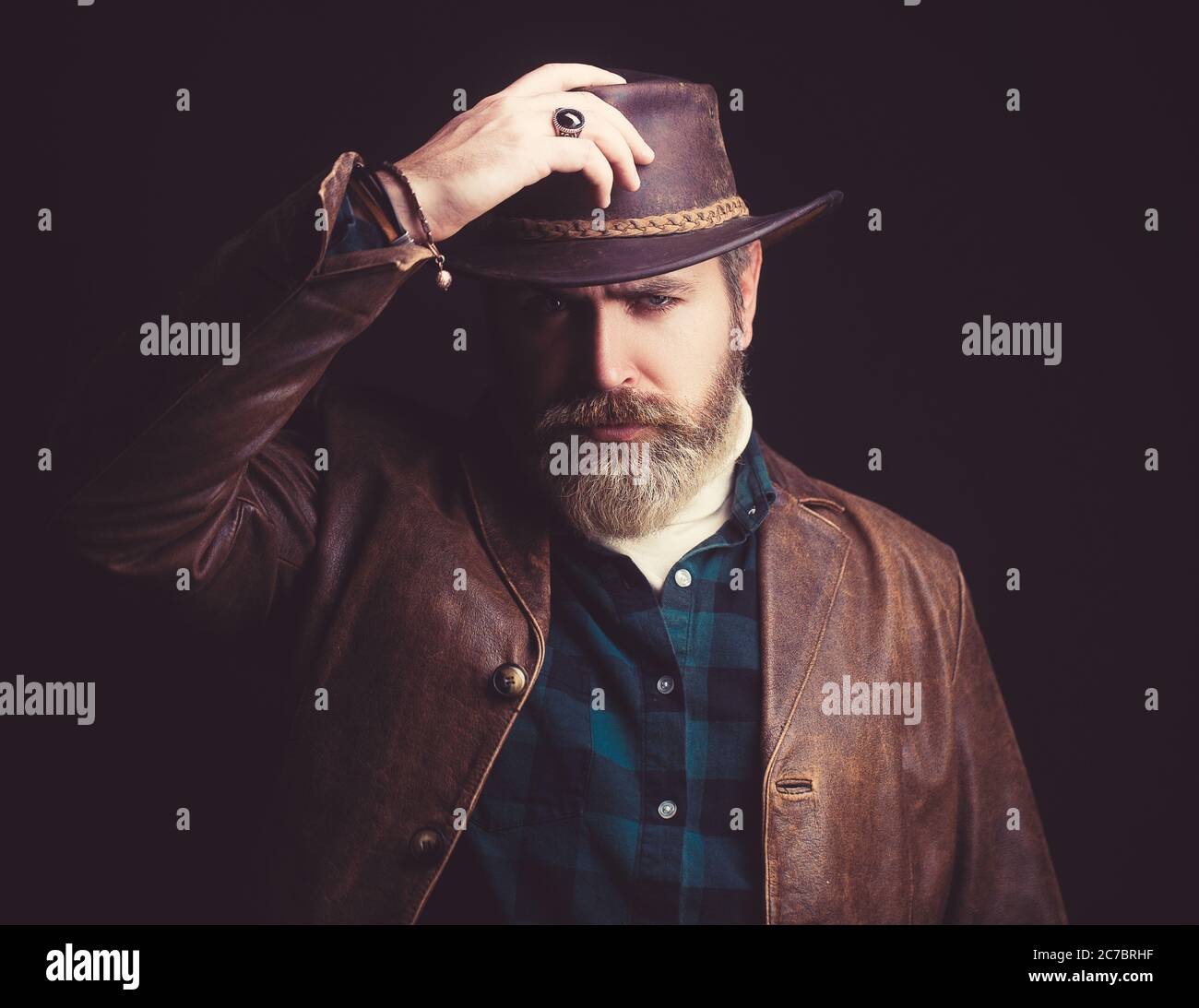 Handsome man in cowboy costume stay in dark. Vampire Hunter Stock Photo