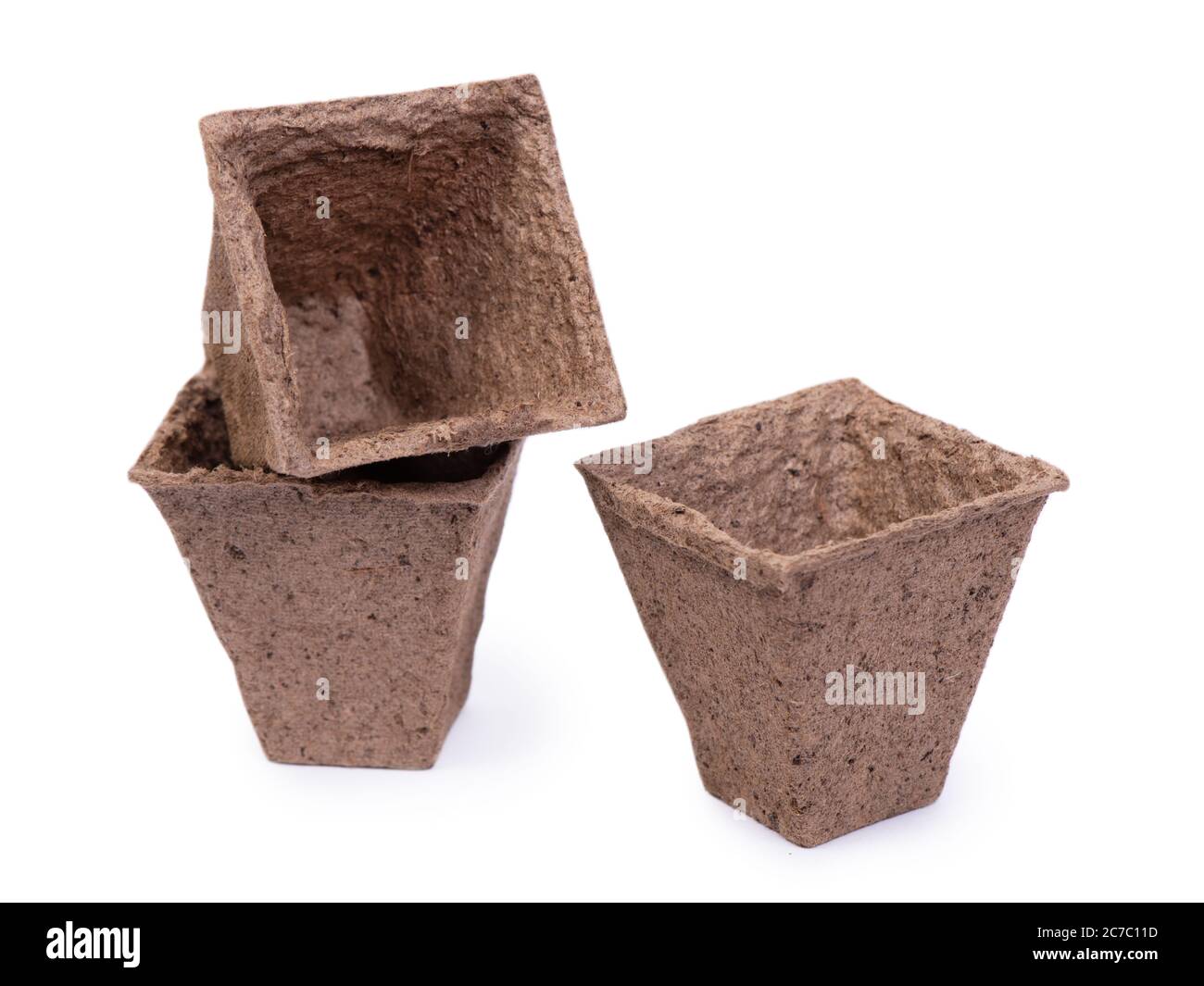 Three empty peat pots isolated on white background Stock Photo