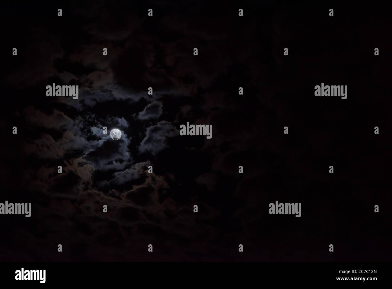 Full moon in the night sky with clouds Stock Photo - Alamy