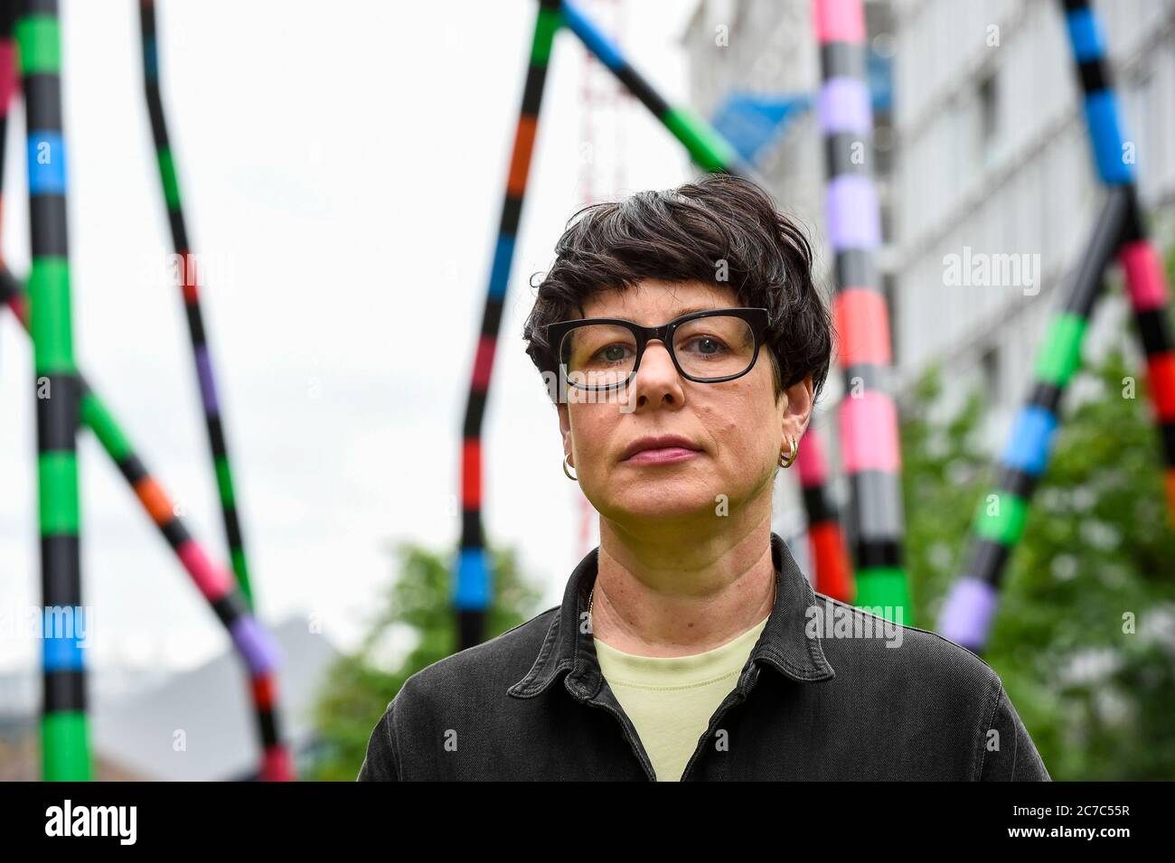 London, UK.  16 July 2020. Major contemporary London-based, Irish artist Eva Rothschild poses at the unveiling of her work 'My World and Your World.  The new 16m high, public sculpture in Lewis Cubitt Park in King's Cross resembles a lightning bolt, painted in black, purple, pink, orange, green and red stripes.  The coronavirus lockdown caused the April 2020 launch to be postponed, but the unveiling has been able to go ahead now that certain lockdown restrictions have been eased by the UK government.  Credit: Stephen Chung / Alamy Live News Stock Photo