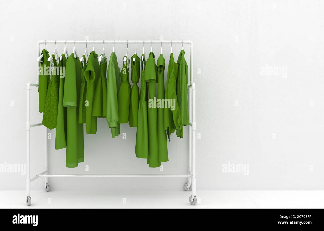 Hanger with green women's clothing against the background of a white wall. Monotonous green clothes. Creative conceptual illustration with copy space. Stock Photo