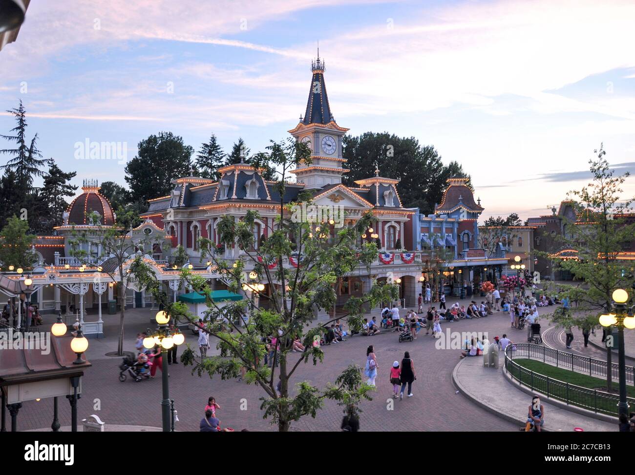 PARIS, FRANCE, July 19, 2010: Square with people in front of the main entrance to the Disneyland Paris. Disneyland Park, one of the attractions of Par Stock Photo