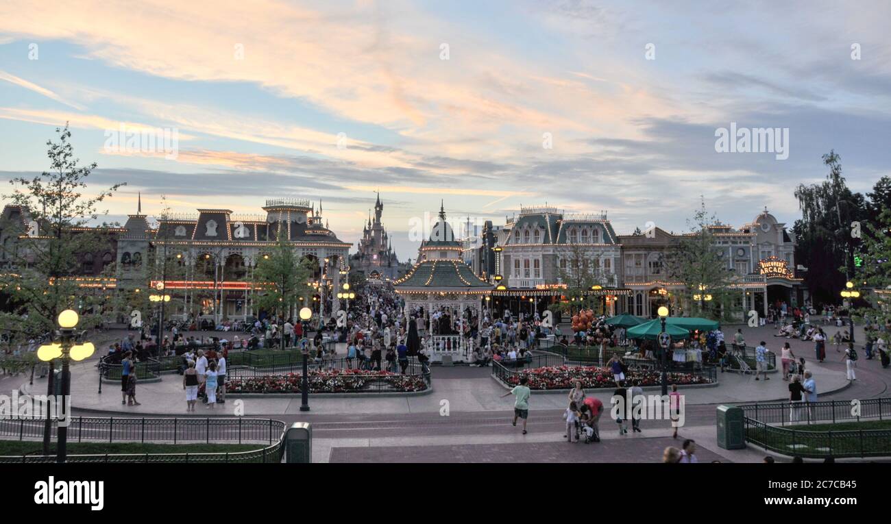 PARIS, FRANCE, July 19, 2010: Square with people in front of the main entrance to the Disneyland Paris. Disneyland Park, one of the attractions of Par Stock Photo