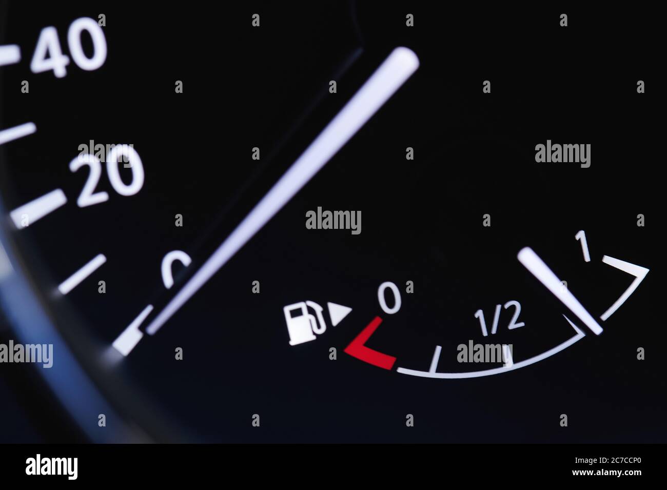 Car fuel indicator illuminated with spped dial close up view Stock