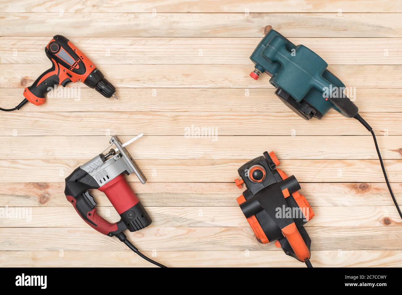 Set of hand carpentry power tools for woodworking lies on a light wooden  background. Directly above Stock Photo - Alamy