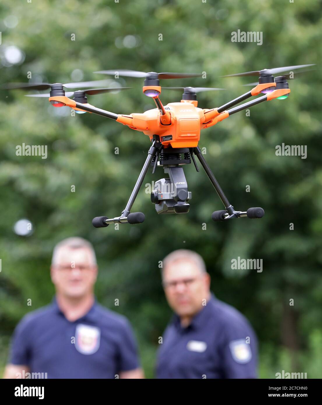 Malchow, Germany. 16th July, 2020. At the State School for Fire and Disaster Control, Volker Hecht (l-r), Stolpe Fire Department, and Jan Müller, instructor, are training with a Yuneec H520 drone. A total of eight Dohnen for fire and disaster control are now ready for deployment in all districts and district-free towns, and the training of 26 pilots for the ErkTr-L air reconnaissance team has been completed. Credit: Bernd Wüstneck/dpa-Zentralbild/ZB/dpa/Alamy Live News Stock Photo
