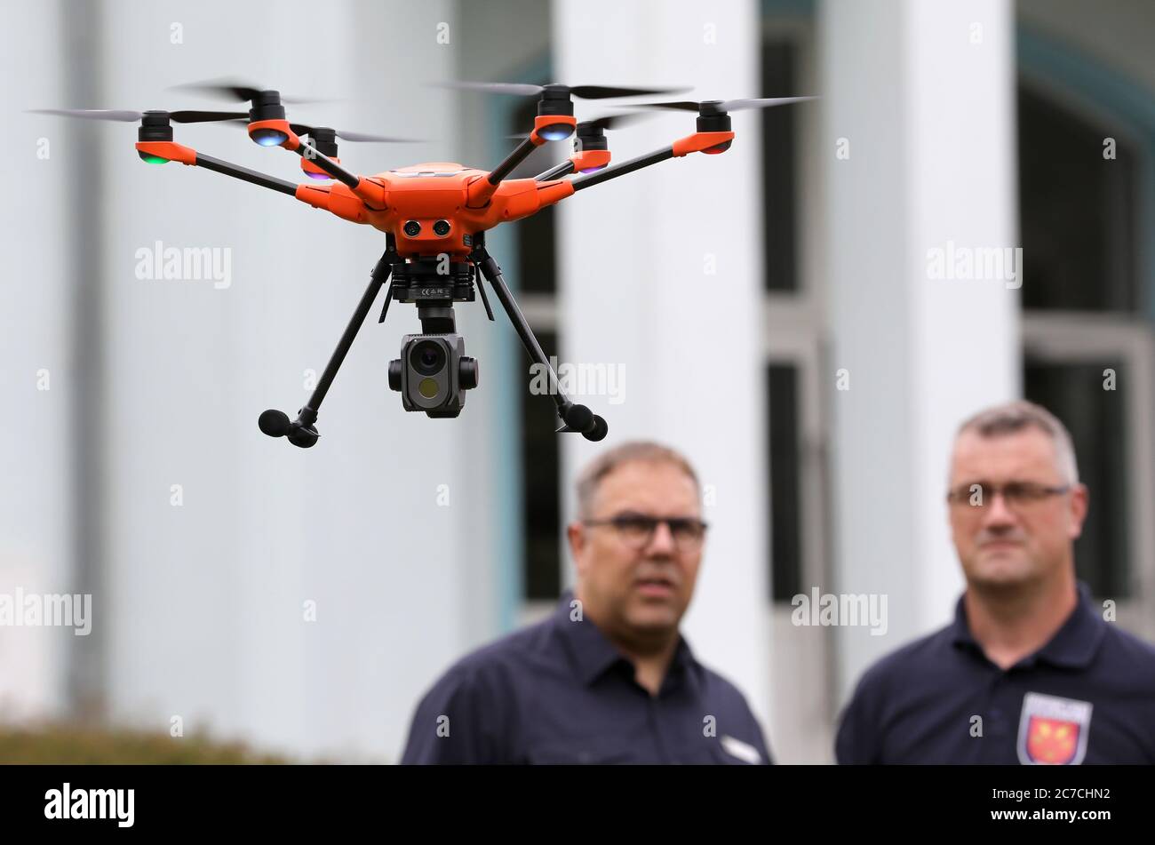 Malchow, Germany. 16th July, 2020. At the State School for Fire and Disaster Protection, Jan Müller (l-r), instructor, and Volker Hecht, Stolpe Fire Department, are training with a Yuneec H520 drone. A total of eight Dohnen for fire and disaster control are now ready for deployment in all districts and district-free towns, and the training of 26 pilots for the ErkTr-L air reconnaissance team has been completed. Credit: Bernd Wüstneck/dpa-Zentralbild/ZB/dpa/Alamy Live News Stock Photo