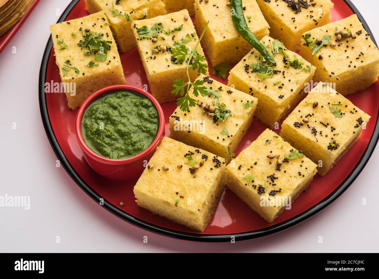 Gujarati Khaman Dhokla made using Chana Dal, served with Green chutney, selective focus Stock