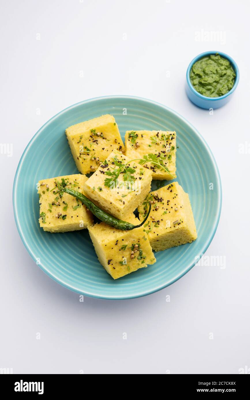 Gujarati Khaman Dhokla made using Chana Dal, served with Green chutney, selective focus Stock