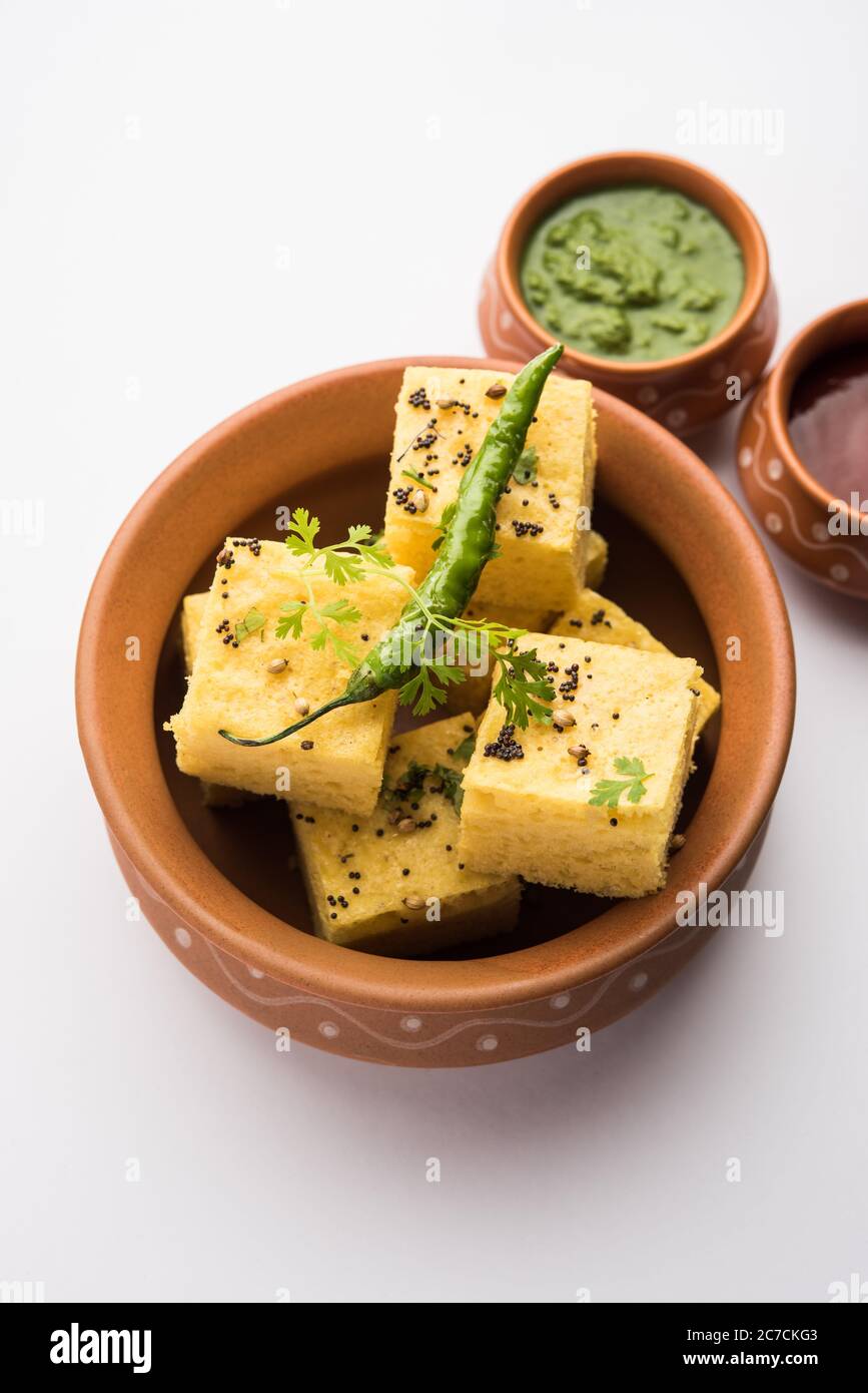 Gujarati Khaman Dhokla made using Chana Dal, served with Green chutney, selective focus Stock