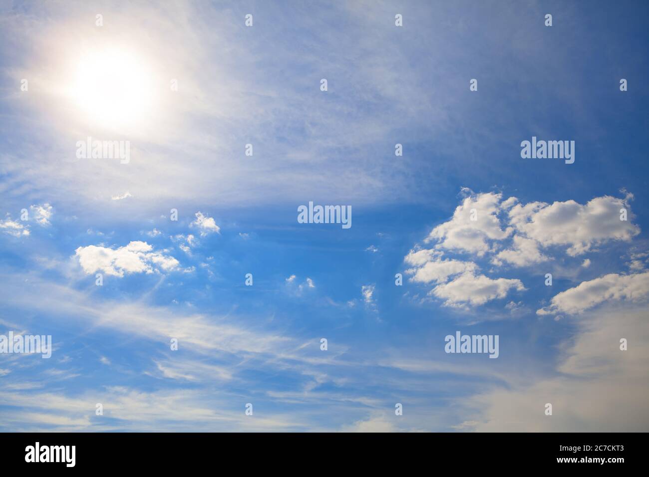 Sundial and light clouds . Summer daytime heaven Stock Photo - Alamy