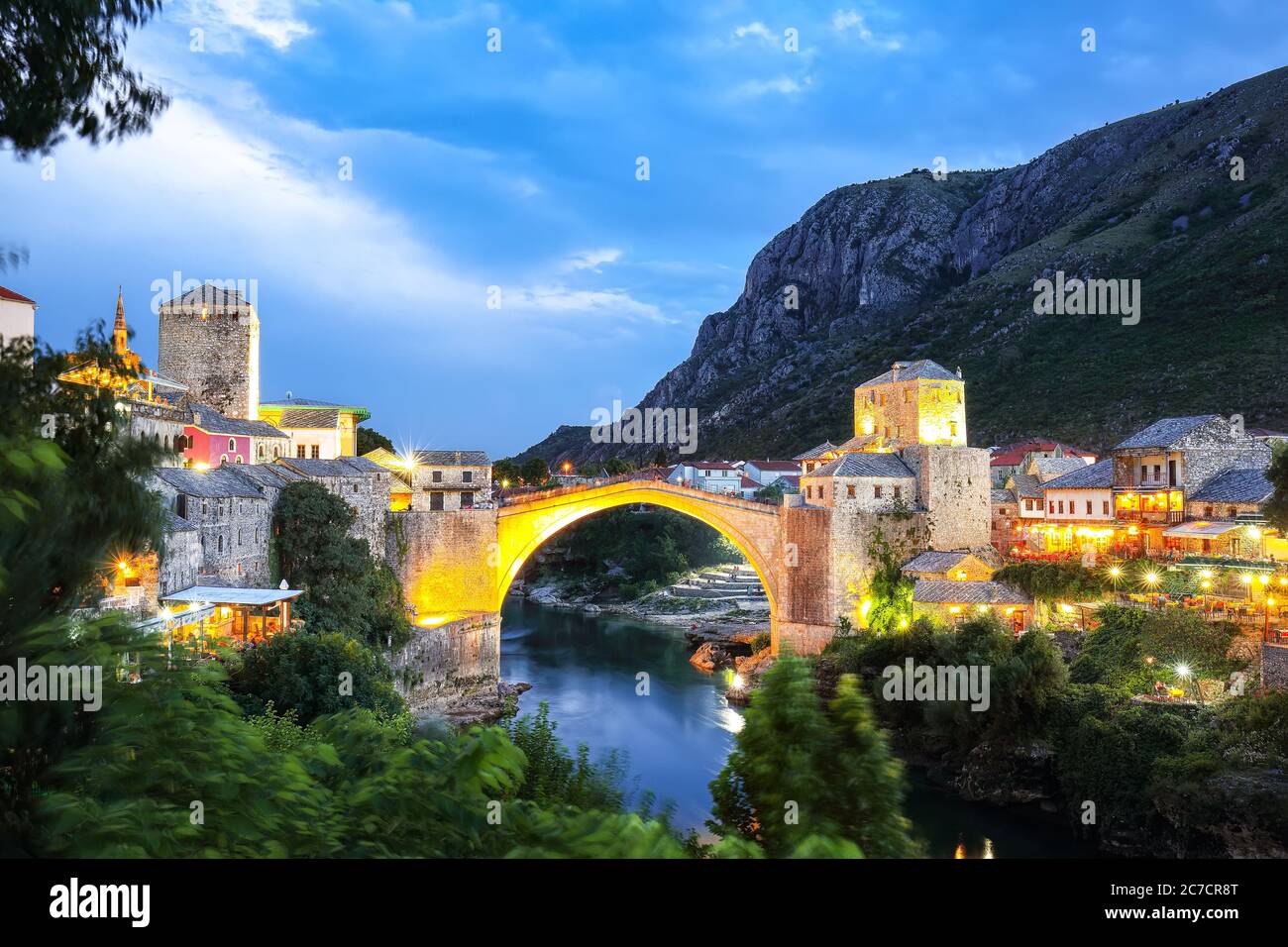 Majestic evening view of Mostar with the Mostar Bridge, houses and  minarets, at evening. Location: Mostar, Old Town, Bosnia and Herzegovina,  Europe Stock Photo - Alamy