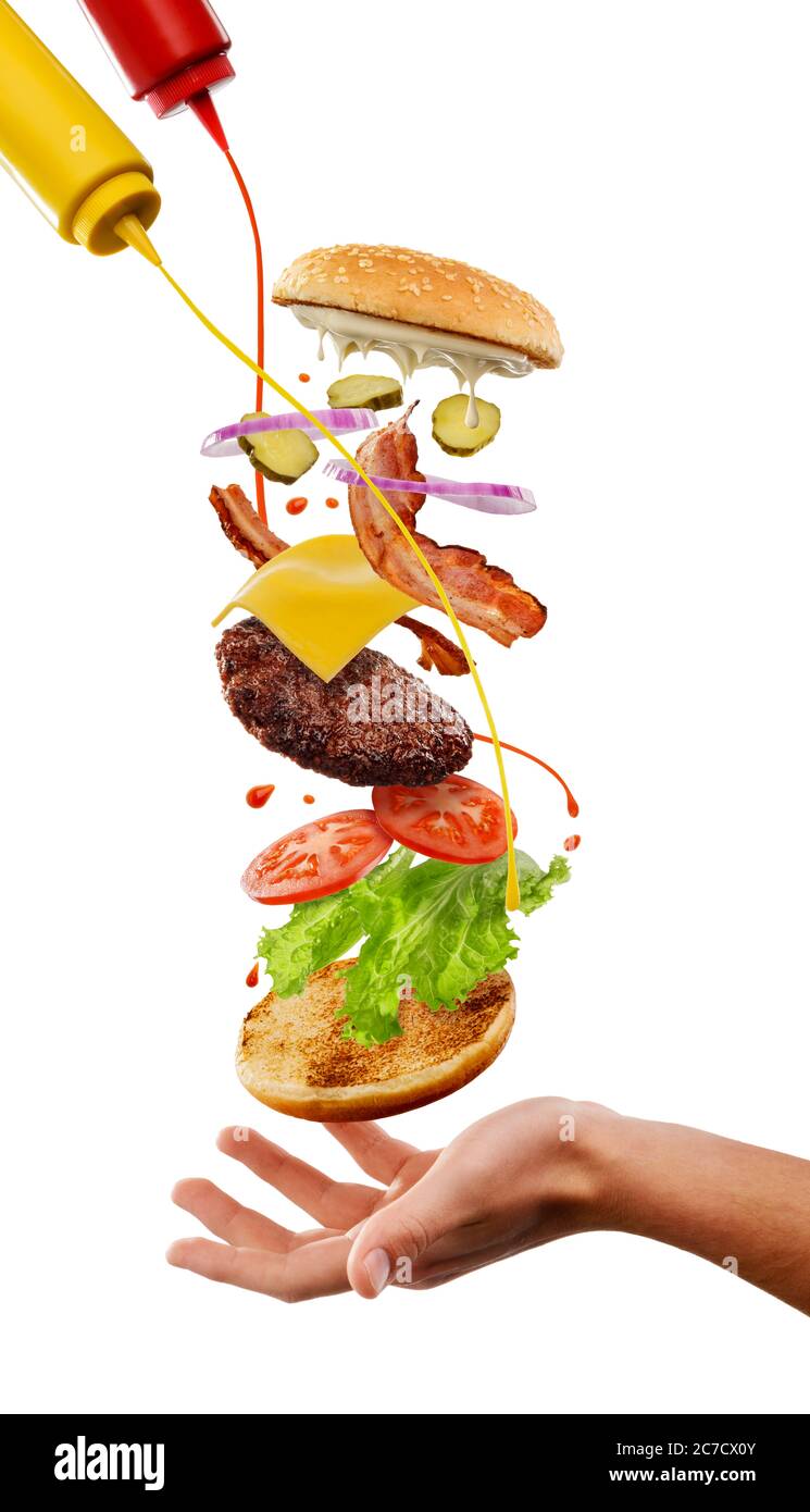Man cooking a cheeseburger. Creative concept, isolated on white background Stock Photo