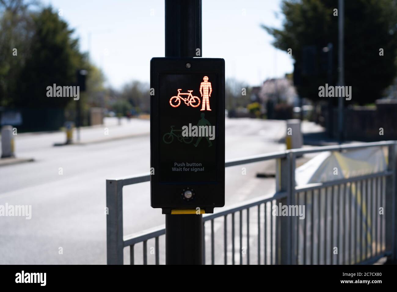 red cycle and person traffic light in the city of London. Lockdown due