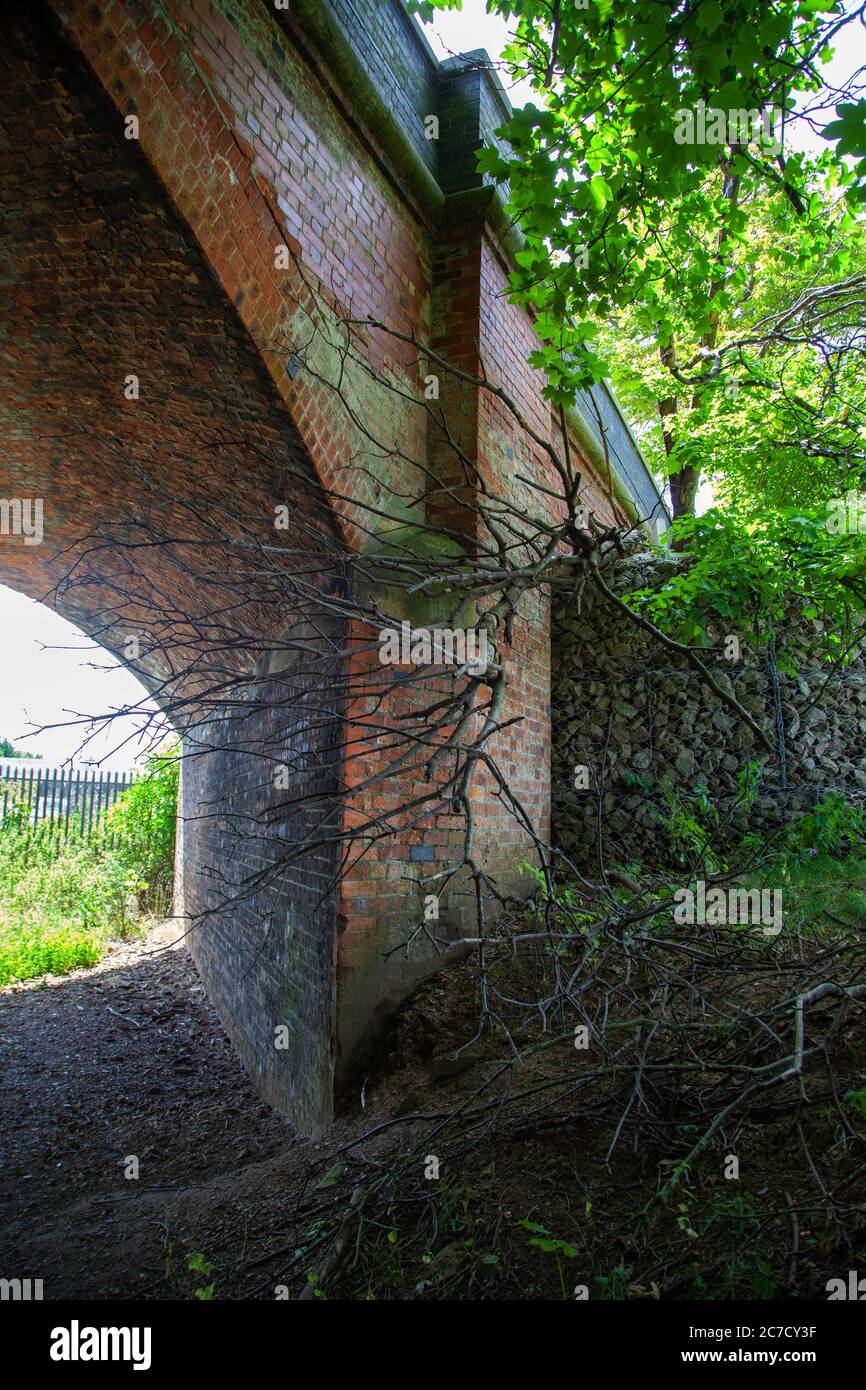 Redundant Victorian Railway bridge, red brick construction. arch architecture, transportation,rural, Great Central Railway Stock Photo