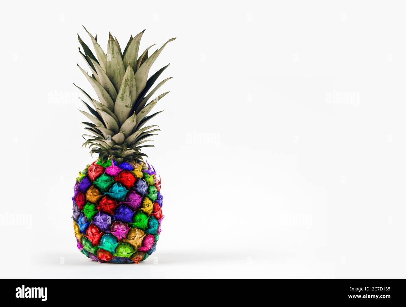 https://c8.alamy.com/comp/2C7D135/colorful-real-pineapple-on-white-background-with-large-copy-space-2C7D135.jpg