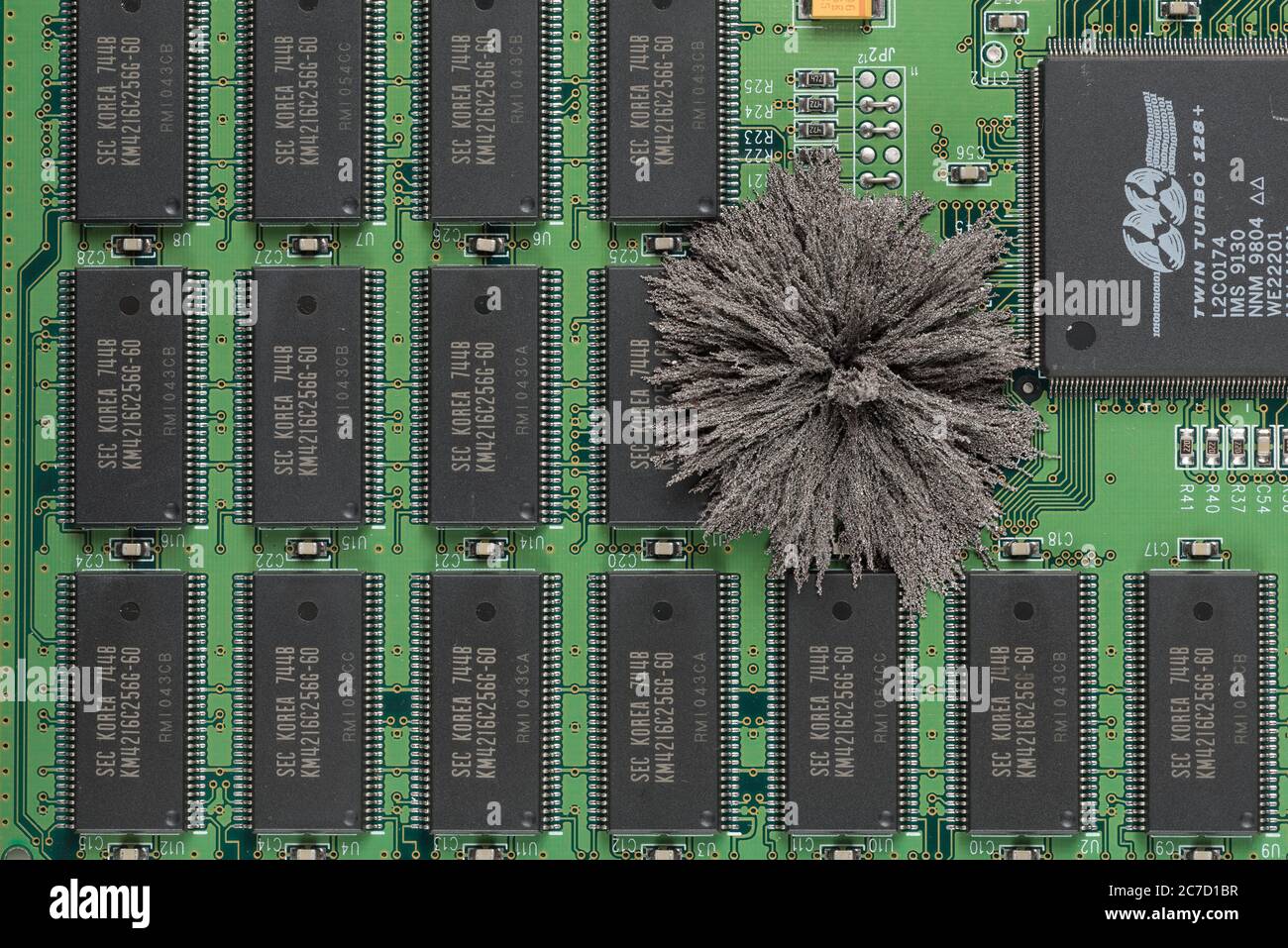 fields passing through Mac computer PC boards where iron filings show invisible field