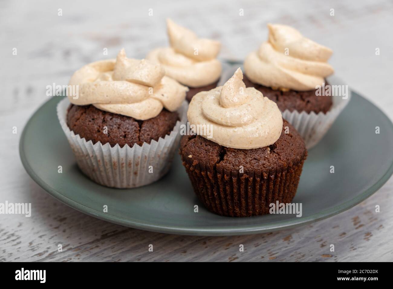 Delicious cupcakes with peanut butter icing Stock Photo
