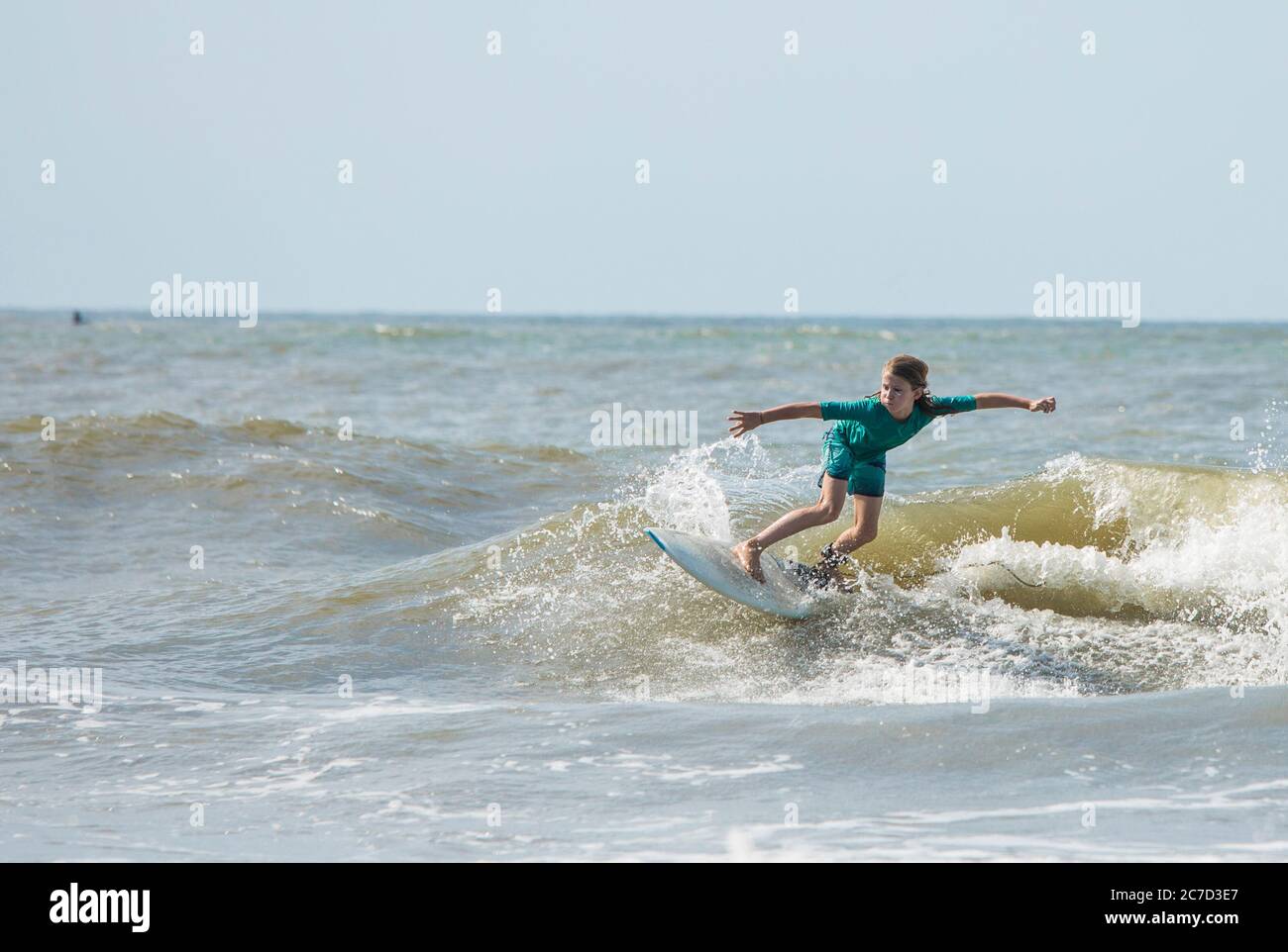A young boy surfs waves on the Atlantic Ocean Stock Photo - Alamy