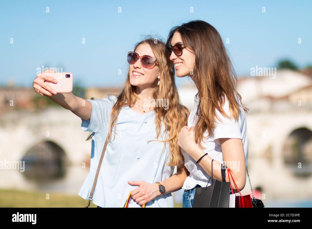 two young tourist girl enjoy shopping and selfie - girlf friend take selfie after shopping Stock Photo