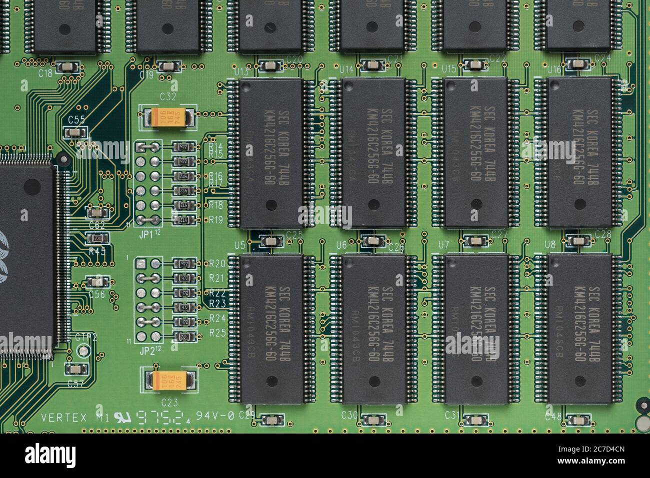 Neat printed circuit board from Mac computer with chip, diode, coil, resistors, capacitors like street layout in city arranged in rows and lines Stock Photo