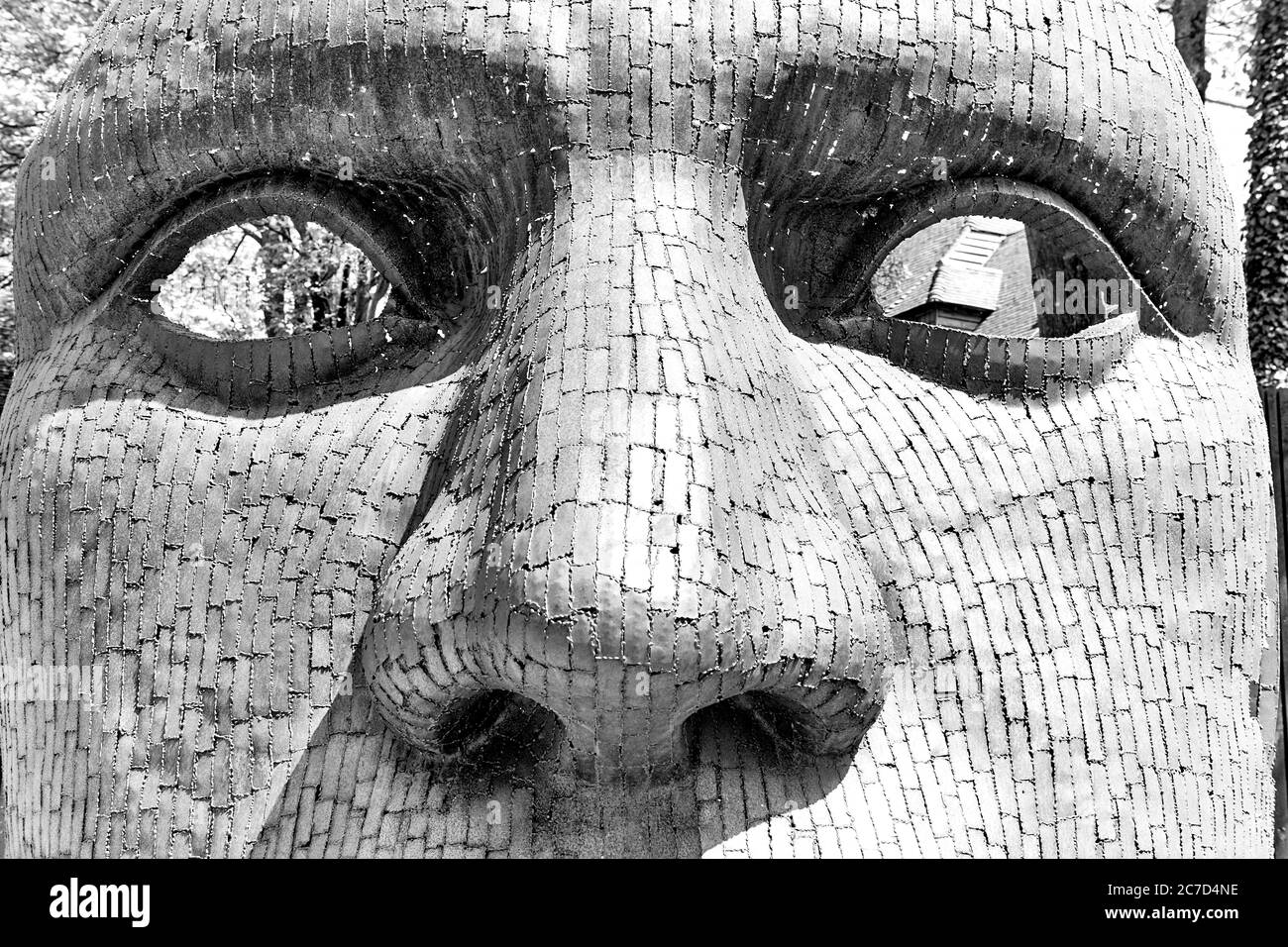 A mask sculpture opposite the Marlowe Theatre in the English Medieval Cathedral town of Canterbury in Kent, England, UK called Bulkhead Stock Photo