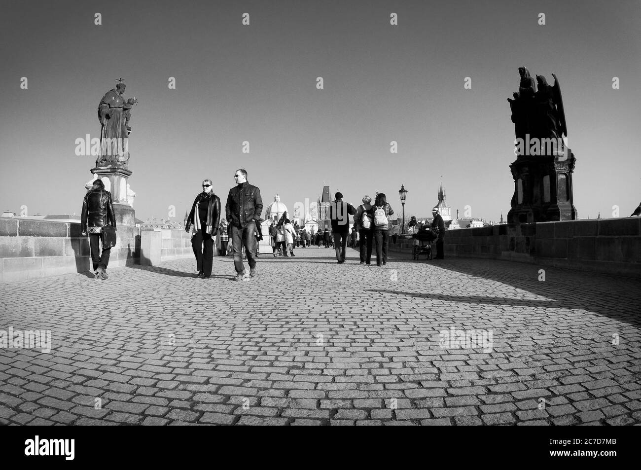 People crossing the Charles Bridge in the city of Prague, the capital city of the Czech Republic. Stock Photo