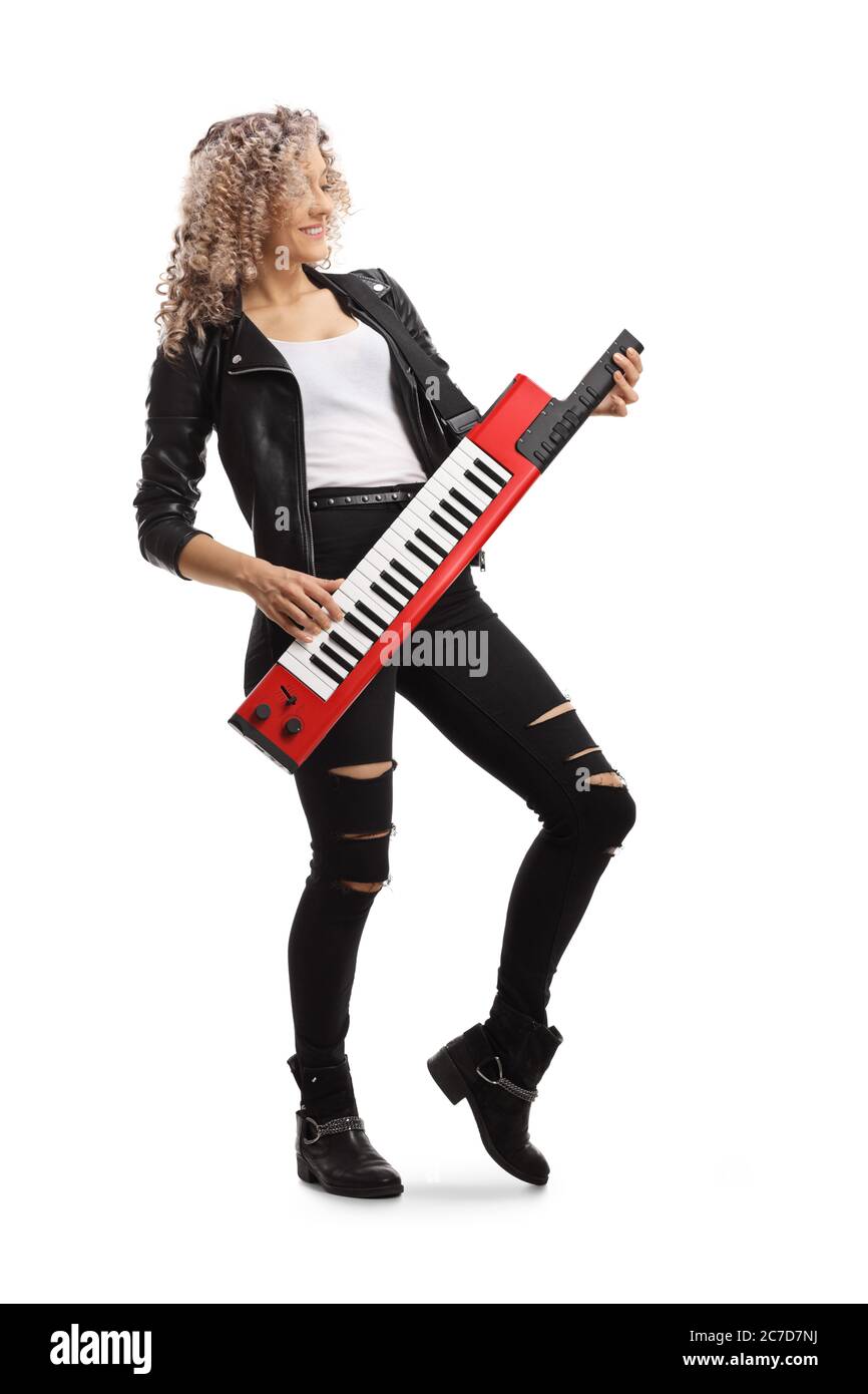 Full length shot of a vintage style female musician with a keytar synthesizer isolated on white background Stock Photo